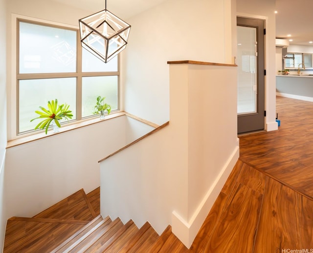 1207 Lilo Pl, Honolulu, HI 96822 - stairs with wood finished floors, a chandelier, and recessed lighting