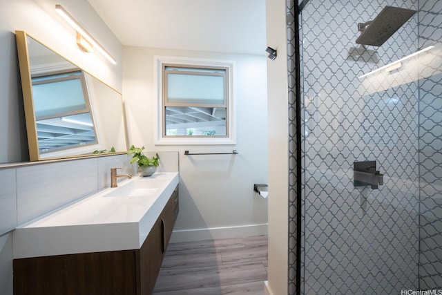 1207 Lilo Pl, Honolulu, HI 96822 - bathroom with vanity, wood finished floors, and a tile shower