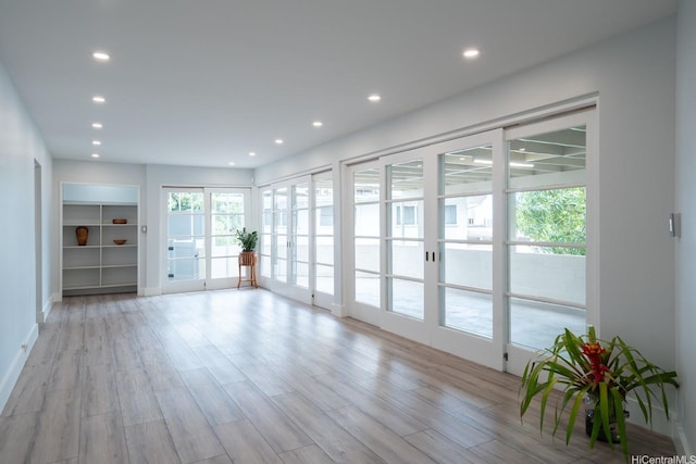 1207 Lilo Pl, Honolulu, HI 96822 - unfurnished living room featuring recessed lighting and light wood finished floors