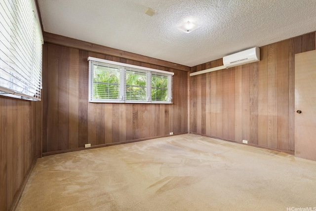 4722 Likini St, Honolulu, HI 96818 - empty room with a wall mounted AC, wooden walls, carpet, and a textured ceiling