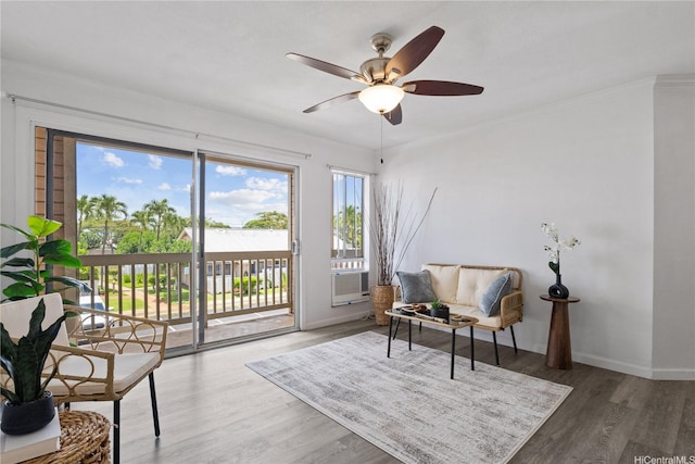 91-1213 Kaneana St Unit 12B, Ewa Beach, HI 96706 - sitting room featuring a ceiling fan, wood finished floors, cooling unit, and ornamental molding