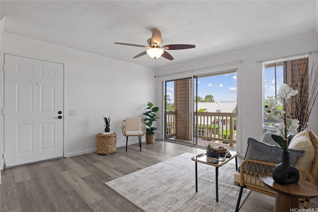 91-1213 Kaneana St Unit 12B, Ewa Beach, HI 96706 - living area with plenty of natural light, ceiling fan, and wood finished floors