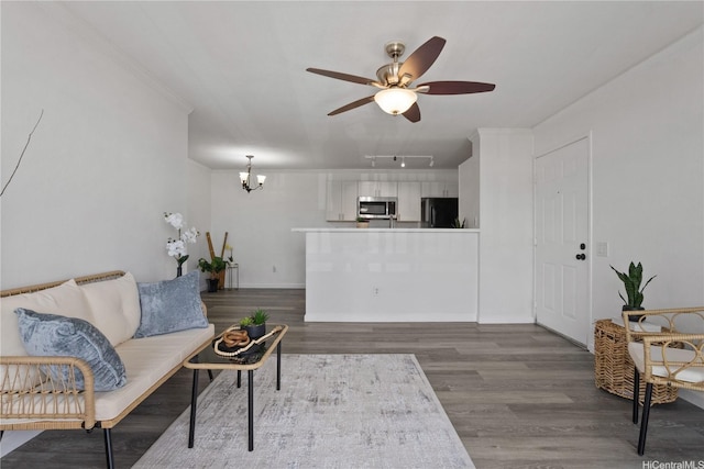 91-1213 Kaneana St Unit 12B, Ewa Beach, HI 96706 - living area with a ceiling fan, wood finished floors, a chandelier, track lighting, and crown molding