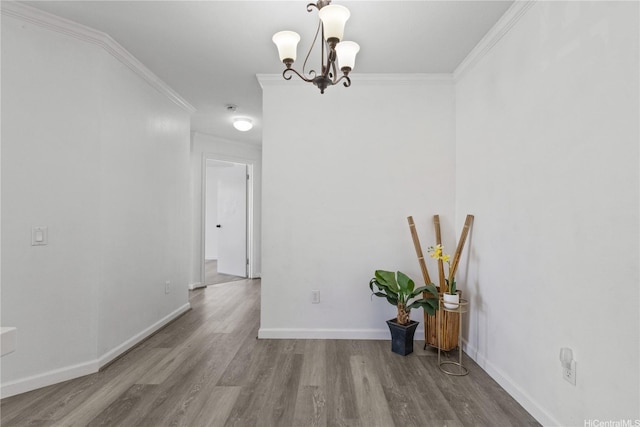 91-1213 Kaneana St Unit 12B, Ewa Beach, HI 96706 - unfurnished dining area featuring crown molding, a chandelier, and wood finished floors