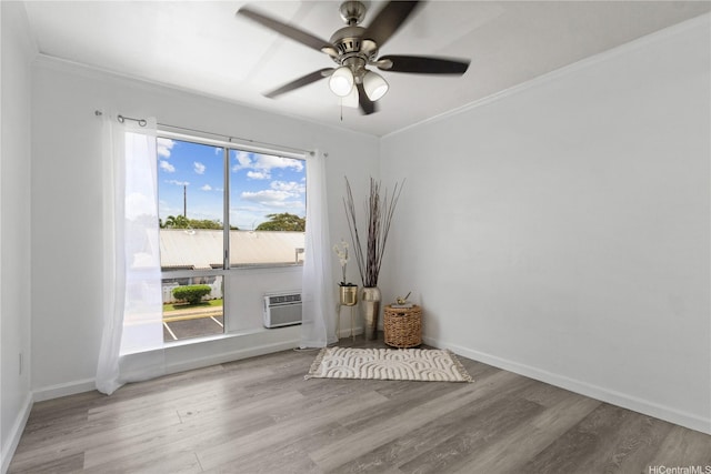 91-1213 Kaneana St Unit 12B, Ewa Beach, HI 96706 - spare room with wood finished floors, a ceiling fan, crown molding, and a wall mounted AC