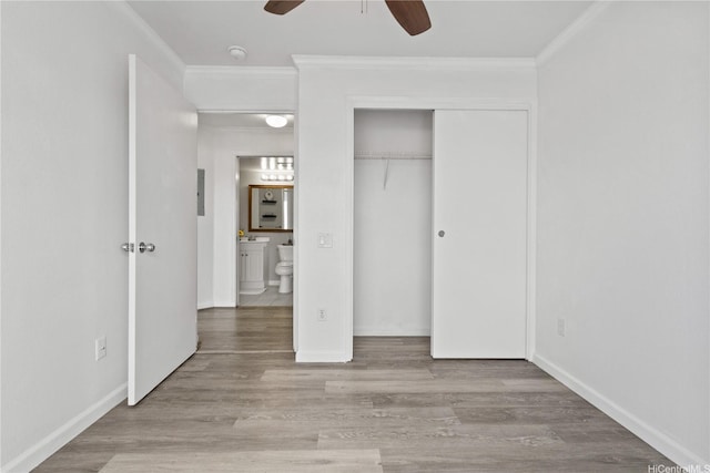 91-1213 Kaneana St Unit 12B, Ewa Beach, HI 96706 - unfurnished bedroom with ornamental molding, wood finished floors, a closet, and ceiling fan