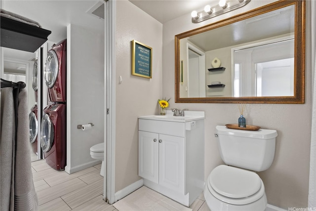 91-1213 Kaneana St Unit 12B, Ewa Beach, HI 96706 - bathroom with stacked washer / drying machine and vanity