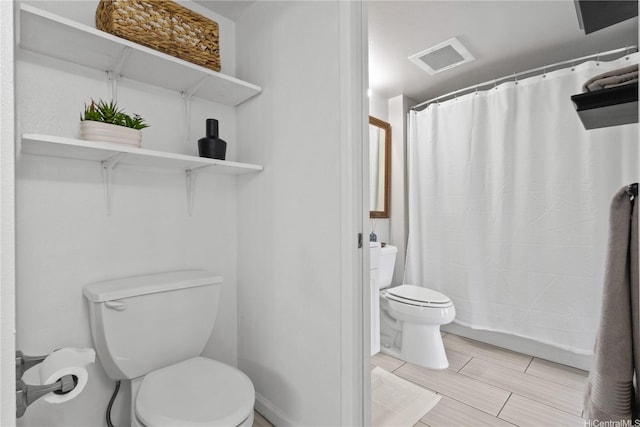 91-1213 Kaneana St Unit 12B, Ewa Beach, HI 96706 - bathroom with toilet and a shower with shower curtain
