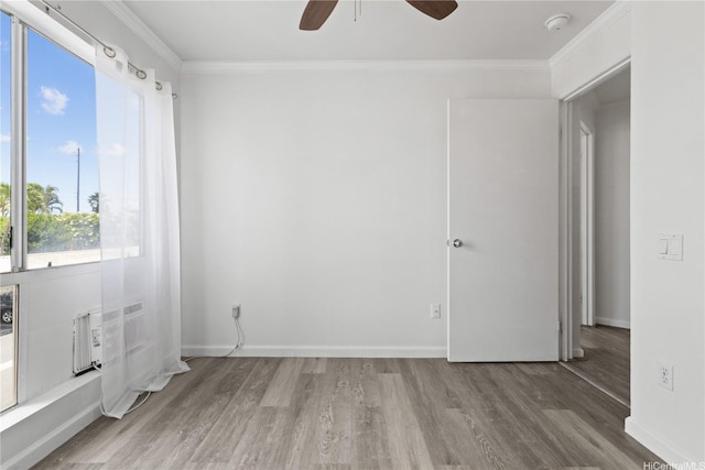 91-1213 Kaneana St Unit 12B, Ewa Beach, HI 96706 - unfurnished room featuring a ceiling fan, wood finished floors, ornamental molding, and a smoke detector