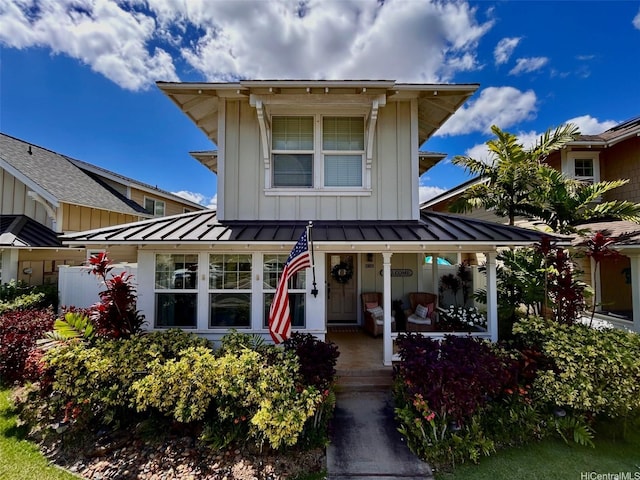 91-1356 Kaileolea Dr, Ewa Beach, HI 96706 - view of front of home with a standing seam roof, board and batten siding, covered porch, and a metal roof