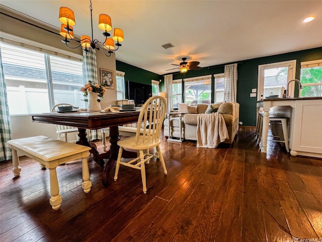 91-1356 Kaileolea Dr, Ewa Beach, HI 96706 - dining space featuring dark wood finished floors, a ceiling fan, and a chandelier