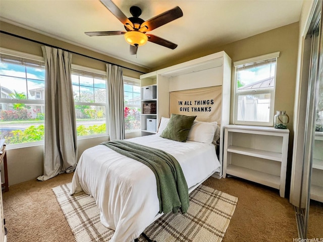 91-1356 Kaileolea Dr, Ewa Beach, HI 96706 - carpeted bedroom featuring multiple windows and a ceiling fan