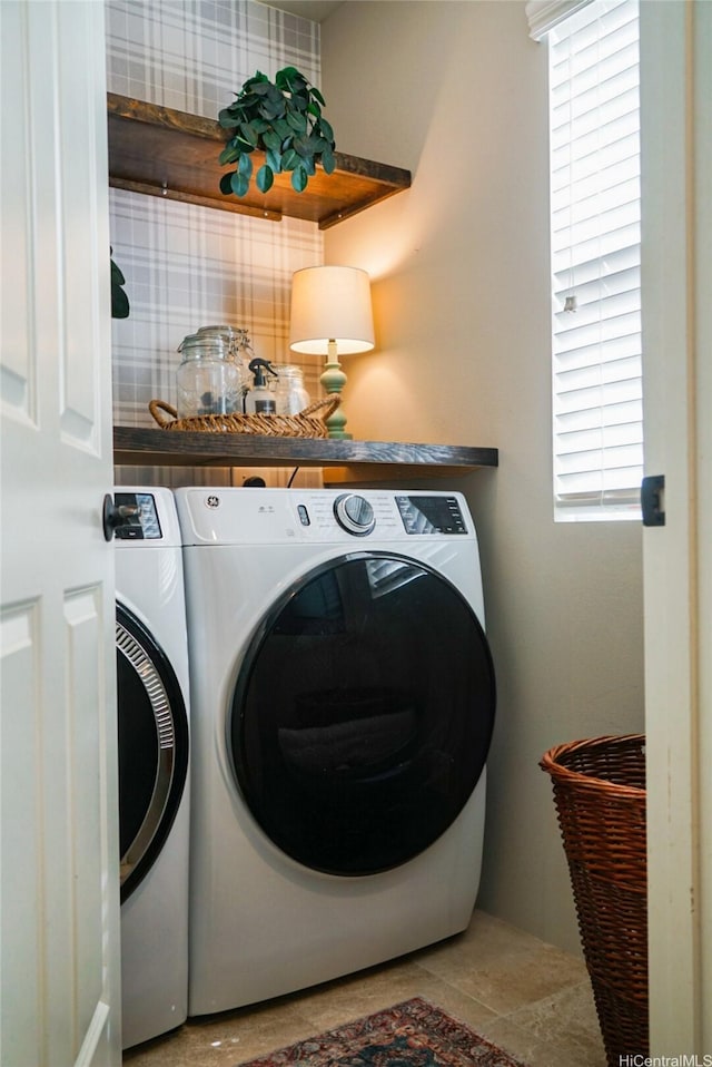 91-1356 Kaileolea Dr, Ewa Beach, HI 96706 - laundry room featuring washing machine and dryer and plenty of natural light
