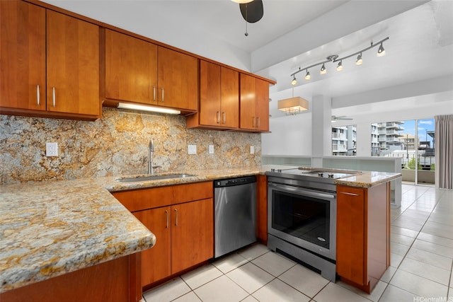 1425 Punahou St Unit 404, Honolulu, HI 96822 - kitchen with appliances with stainless steel finishes, ceiling fan, a peninsula, and brown cabinets