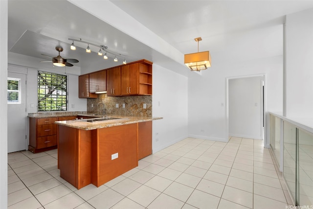 1425 Punahou St Unit 404, Honolulu, HI 96822 - kitchen featuring open shelves, brown cabinets, decorative backsplash, and a peninsula