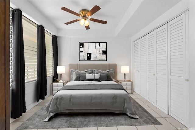 1425 Punahou St Unit 404, Honolulu, HI 96822 - bedroom featuring light tile patterned floors, a ceiling fan, and a closet