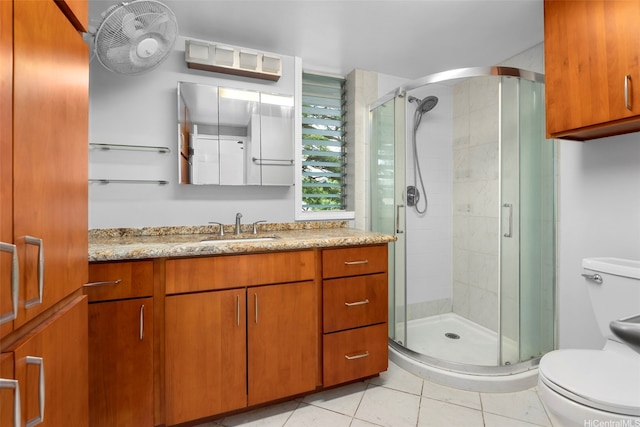 1425 Punahou St Unit 404, Honolulu, HI 96822 - bathroom featuring vanity, a stall shower, and tile patterned flooring