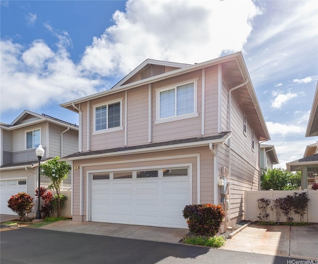 91-1001 Keaunui Dr Unit 106, Ewa Beach, HI 96706 - view of front facade featuring an attached garage and driveway