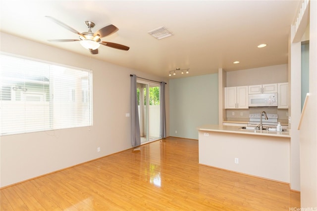 91-1001 Keaunui Dr Unit 106, Ewa Beach, HI 96706 - unfurnished living room featuring light wood-style floors, ceiling fan, and recessed lighting