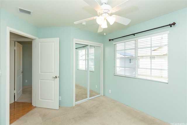 91-1001 Keaunui Dr Unit 106, Ewa Beach, HI 96706 - unfurnished bedroom featuring carpet, a closet, and a ceiling fan