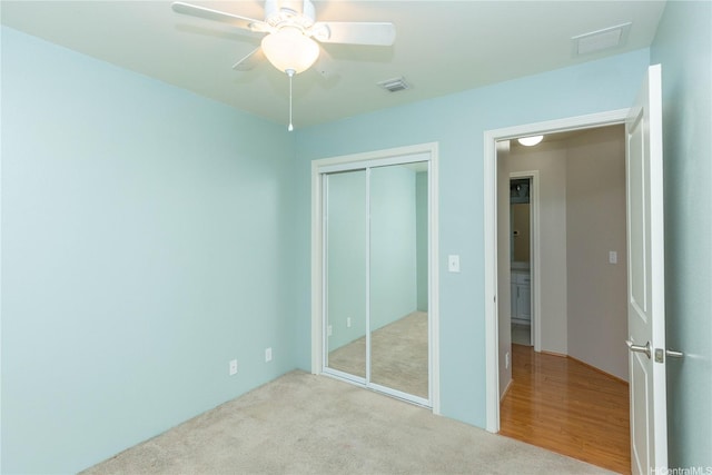 91-1001 Keaunui Dr Unit 106, Ewa Beach, HI 96706 - unfurnished bedroom with a closet, carpet flooring, and ceiling fan
