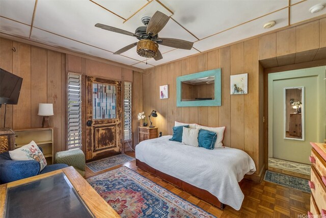 259 N Kalaheo Ave Unit A, Kailua, HI 96734 - bedroom featuring wood walls and a ceiling fan