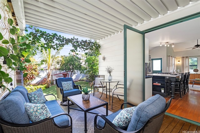 2633B Nahaku Pl Unit H, Honolulu, HI 96826 - fenced backyard with an outdoor living space, a ceiling fan, outdoor dining space, and a deck