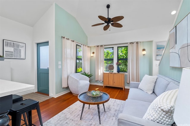 2633B Nahaku Pl Unit H, Honolulu, HI 96826 - living area with a wall mounted air conditioner, wood finished floors, a ceiling fan, and high vaulted ceiling