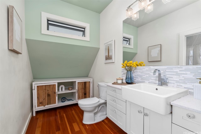 2633B Nahaku Pl Unit H, Honolulu, HI 96826 - bathroom featuring wood finished floors, vanity, and tasteful backsplash