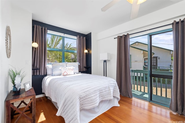 2633B Nahaku Pl Unit H, Honolulu, HI 96826 - bedroom with access to exterior, wood finished floors, and ceiling fan
