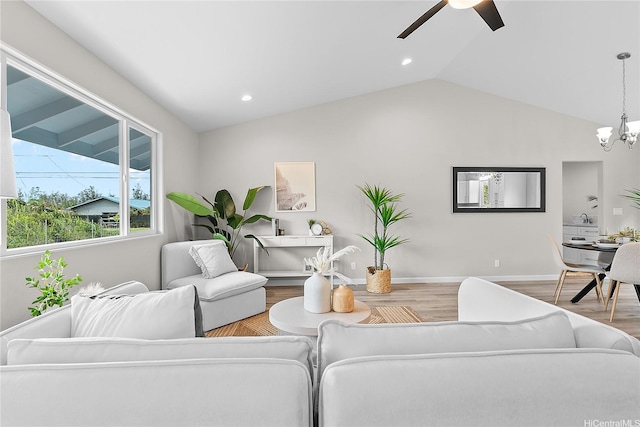 16-2154 Coral Dr, Pahoa, HI 96778 - living room featuring wood finished floors, vaulted ceiling, ceiling fan, a chandelier, and recessed lighting