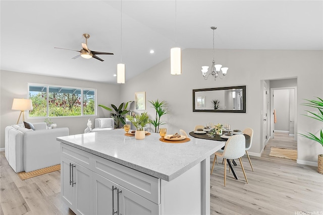 16-2154 Coral Dr, Pahoa, HI 96778 - kitchen featuring vaulted ceiling, light wood-type flooring, a chandelier, a center island, and open floor plan