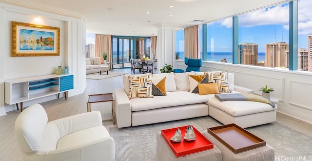 1888 Kalakaua Ave Unit 3504, Honolulu, HI 96815 - living area with a water view, wood finished floors, a wall of windows, and a decorative wall