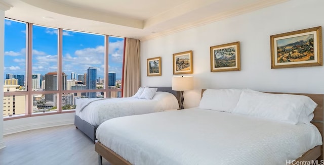 1888 Kalakaua Ave Unit 3504, Honolulu, HI 96815 - bedroom with a view of skyline, wood finished floors, and ornamental molding
