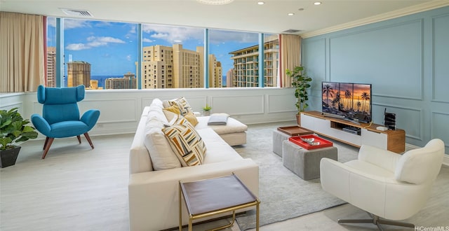 1888 Kalakaua Ave Unit 3504, Honolulu, HI 96815 - living room featuring a decorative wall, wood finished floors, recessed lighting, and ornamental molding