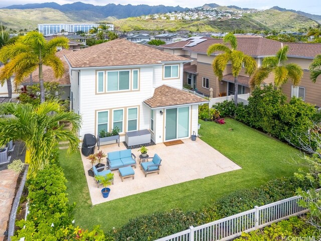 520 Lunalilo Home Rd Unit 354, Honolulu, HI 96825 - back of property with a fenced backyard, a shingled roof, outdoor lounge area, and a mountain view