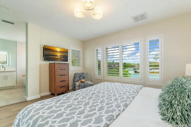520 Lunalilo Home Rd Unit 354, Honolulu, HI 96825 - bedroom with light wood-style flooring and connected bathroom