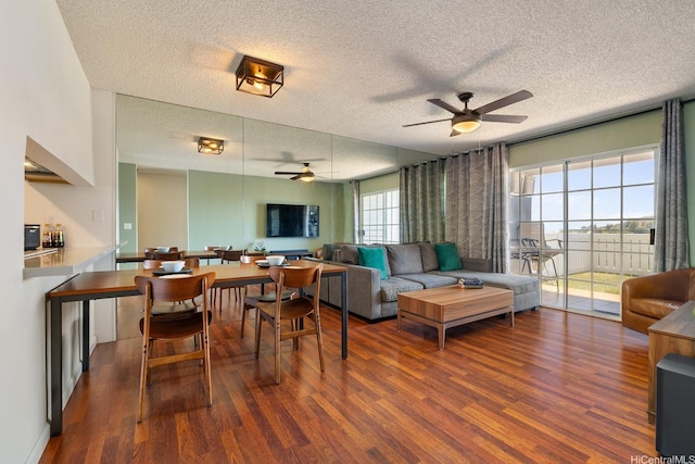 92-1005 Nou St Unit 5103, Kapolei, HI 96707 - living area featuring a ceiling fan, wood finished floors, and a textured ceiling