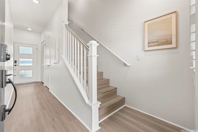 91-3633 Kauluakoko St Unit 1004, Ewa Beach, HI 96706 - entrance foyer featuring wood finished floors, recessed lighting, and stairs