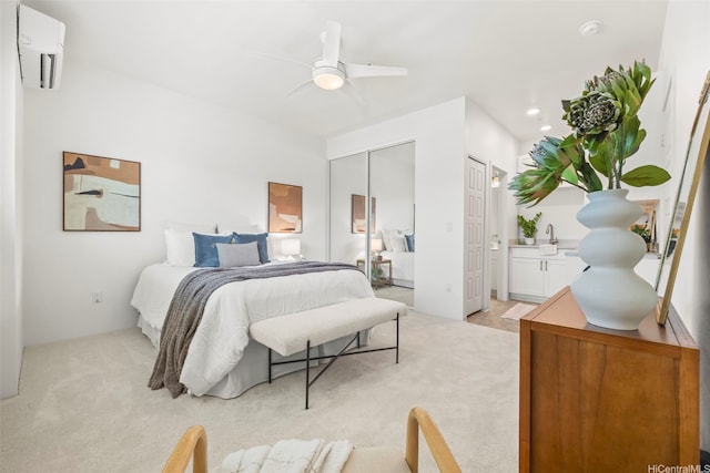 91-3633 Kauluakoko St Unit 1004, Ewa Beach, HI 96706 - bedroom featuring a wall mounted air conditioner, light carpet, and ceiling fan