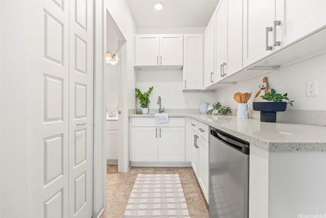 91-3633 Kauluakoko St Unit 1004, Ewa Beach, HI 96706 - kitchen with stainless steel dishwasher, white cabinetry, light stone countertops, and recessed lighting