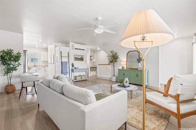 91-3633 Kauluakoko St Unit 1004, Ewa Beach, HI 96706 - living room with a wall mounted AC, a ceiling fan, light wood-style flooring, recessed lighting, and vaulted ceiling