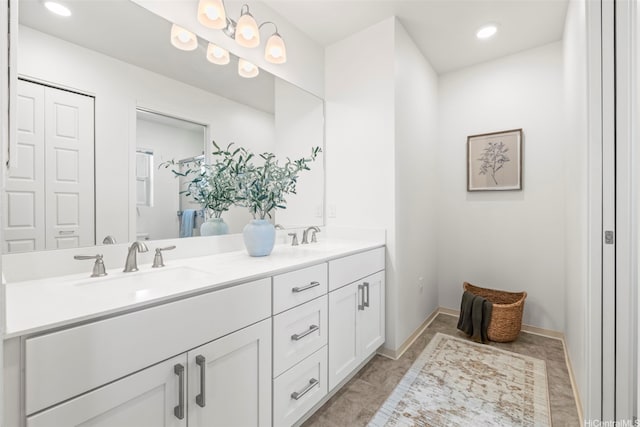 91-3633 Kauluakoko St Unit 1004, Ewa Beach, HI 96706 - bathroom featuring double vanity, recessed lighting, and a closet