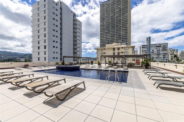 2211 Ala Wai Blvd Unit 3201, Honolulu, HI 96815 - community pool featuring a patio area, a view of city, and a hot tub
