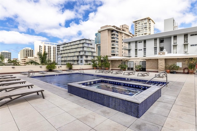 2211 Ala Wai Blvd Unit 3201, Honolulu, HI 96815 - community pool featuring a community hot tub, a patio, and a city view