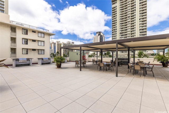 2211 Ala Wai Blvd Unit 3201, Honolulu, HI 96815 - view of patio / terrace with outdoor dining area and a city view