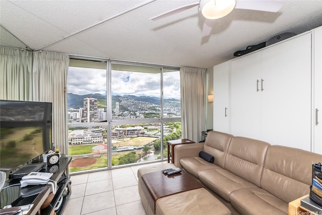 2211 Ala Wai Blvd Unit 3201, Honolulu, HI 96815 - living room featuring floor to ceiling windows, a ceiling fan, light tile patterned floors, and a view of city