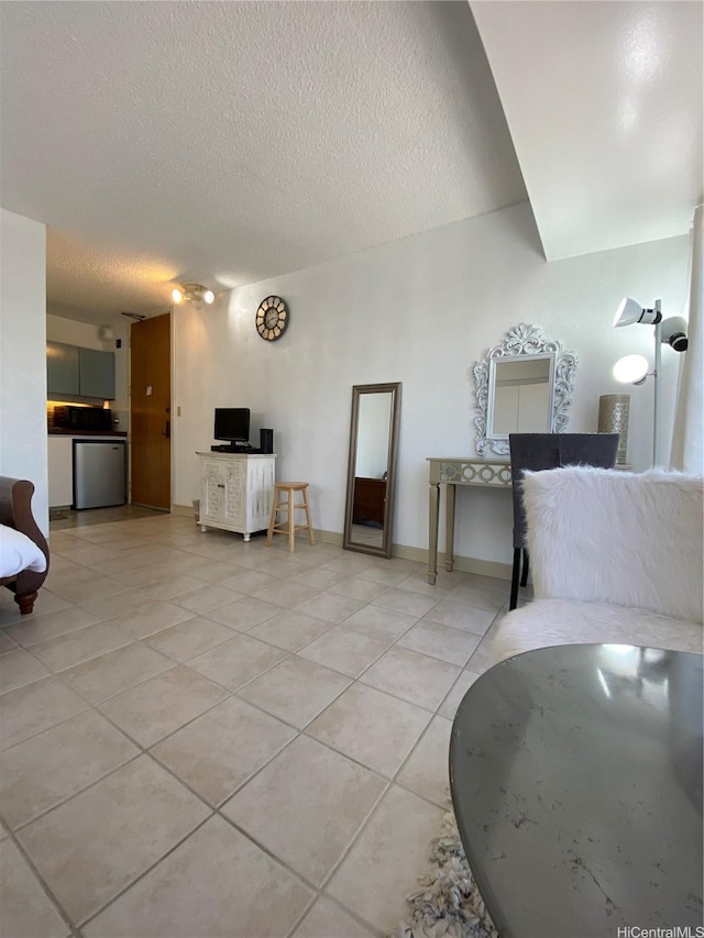 1750 Kalakaua Ave Unit 1507, Honolulu, HI 96826 - living area featuring light tile patterned floors and a textured ceiling