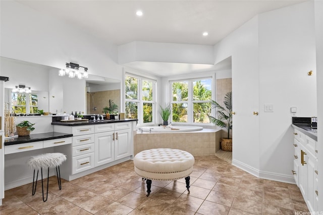 91-1298 Kuanoo St, Ewa Beach, HI 96706 - bathroom featuring vanity, plenty of natural light, a bath, and recessed lighting