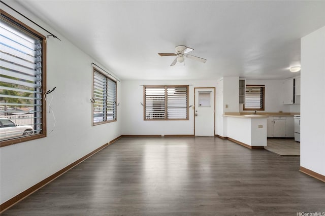 84-570 Farrington Hwy Unit D, Waianae, HI 96792 - unfurnished living room with a ceiling fan and dark wood finished floors